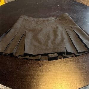 Black pleated wrap skirt. Q Mack brand. Woman’s size L.